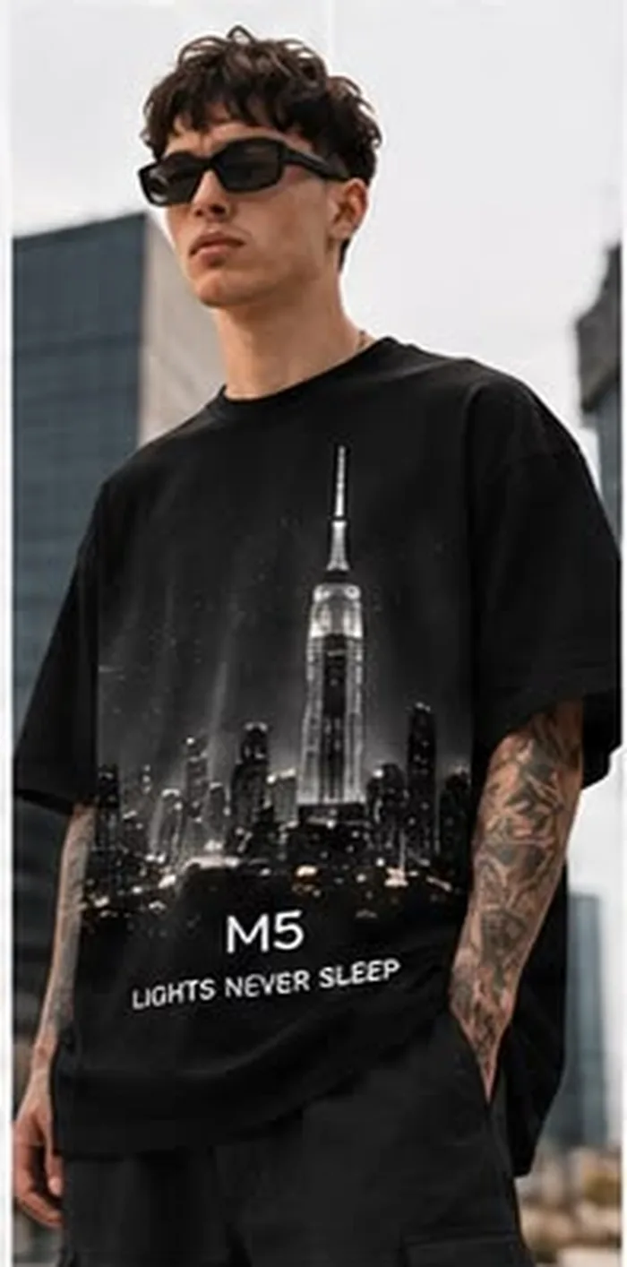 Model wearing a black M5 Outfit T-shirt printed with a night city skyline and Lights Never Sleep text